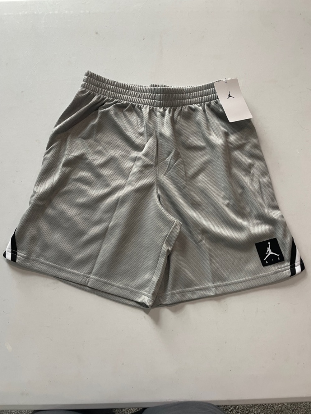 NEW! JORDAN GRAY BASKETBALL SHORTS W/ BLACK&WHITE TRIM. SIZE LARGE (12-13) BOYS.